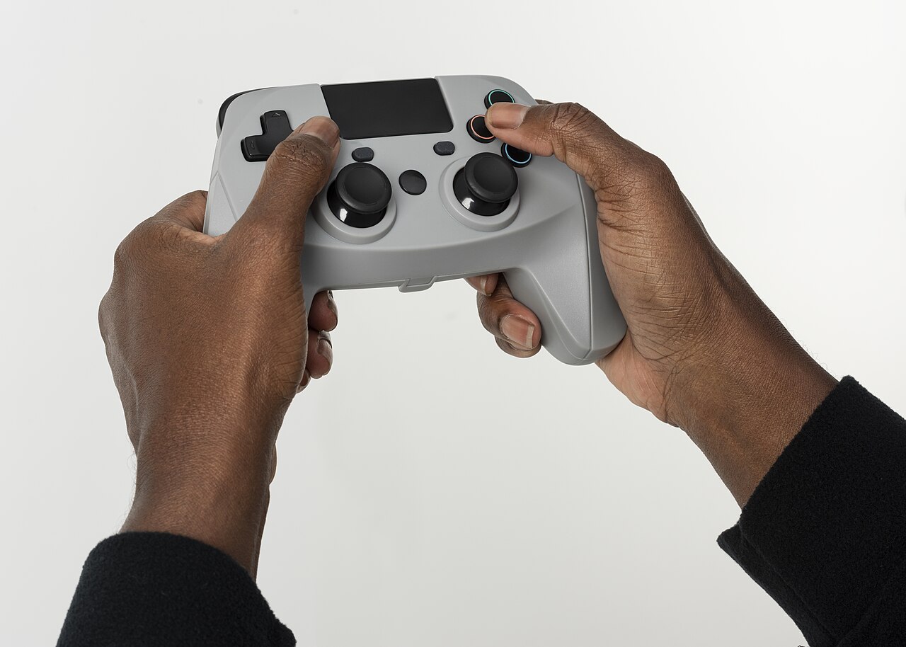 Hands holding a video game controller