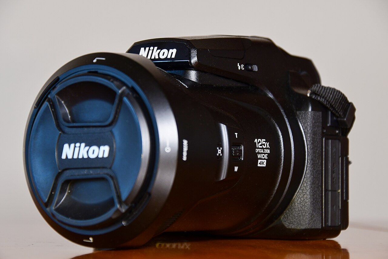 Nikon COOLPIX P1000 superzoom bridge camera showing 125x optical zoom lens barrel