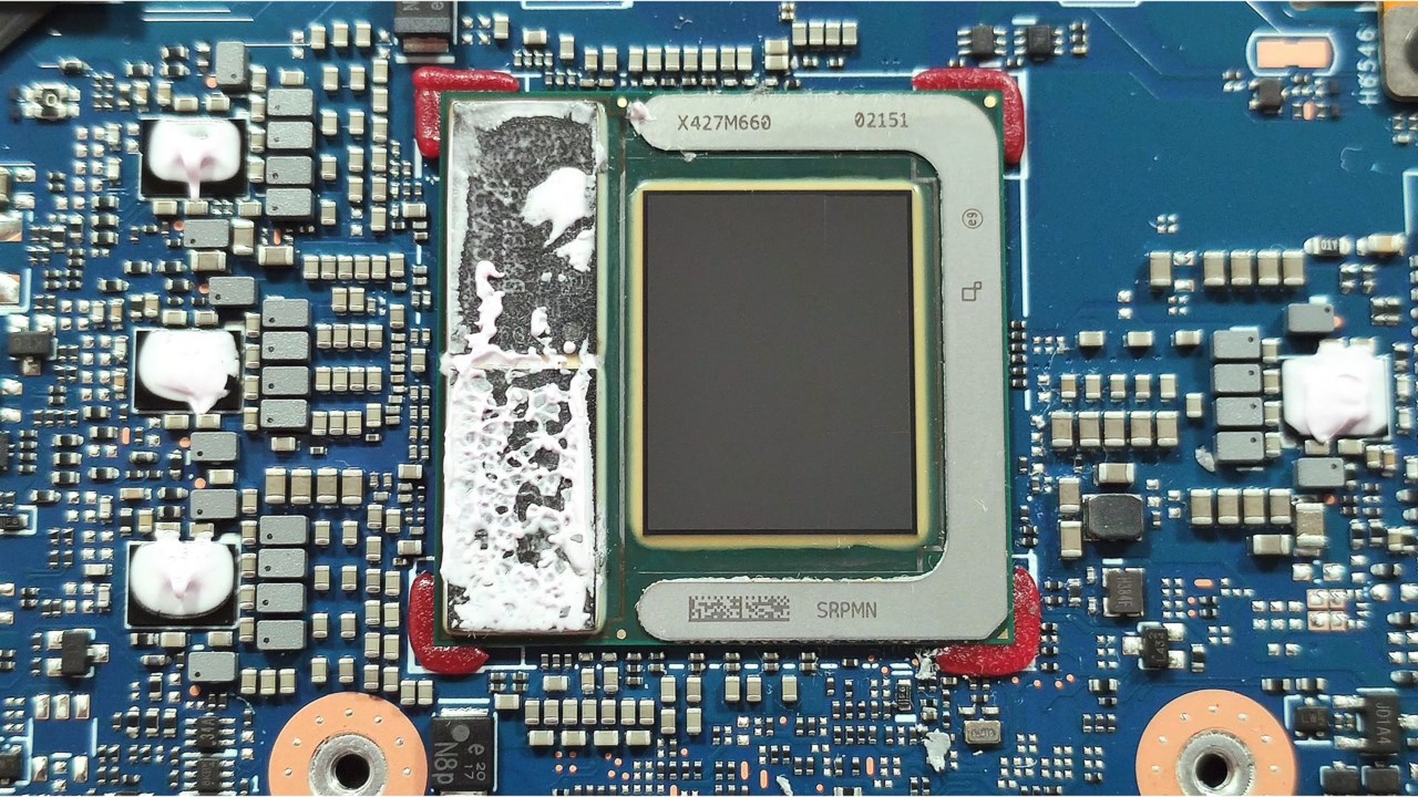 Close-up of an Intel Core Ultra processor with integrated graphics soldered onto a laptop motherboard, showing how the GPU shares the same chip as the CPU