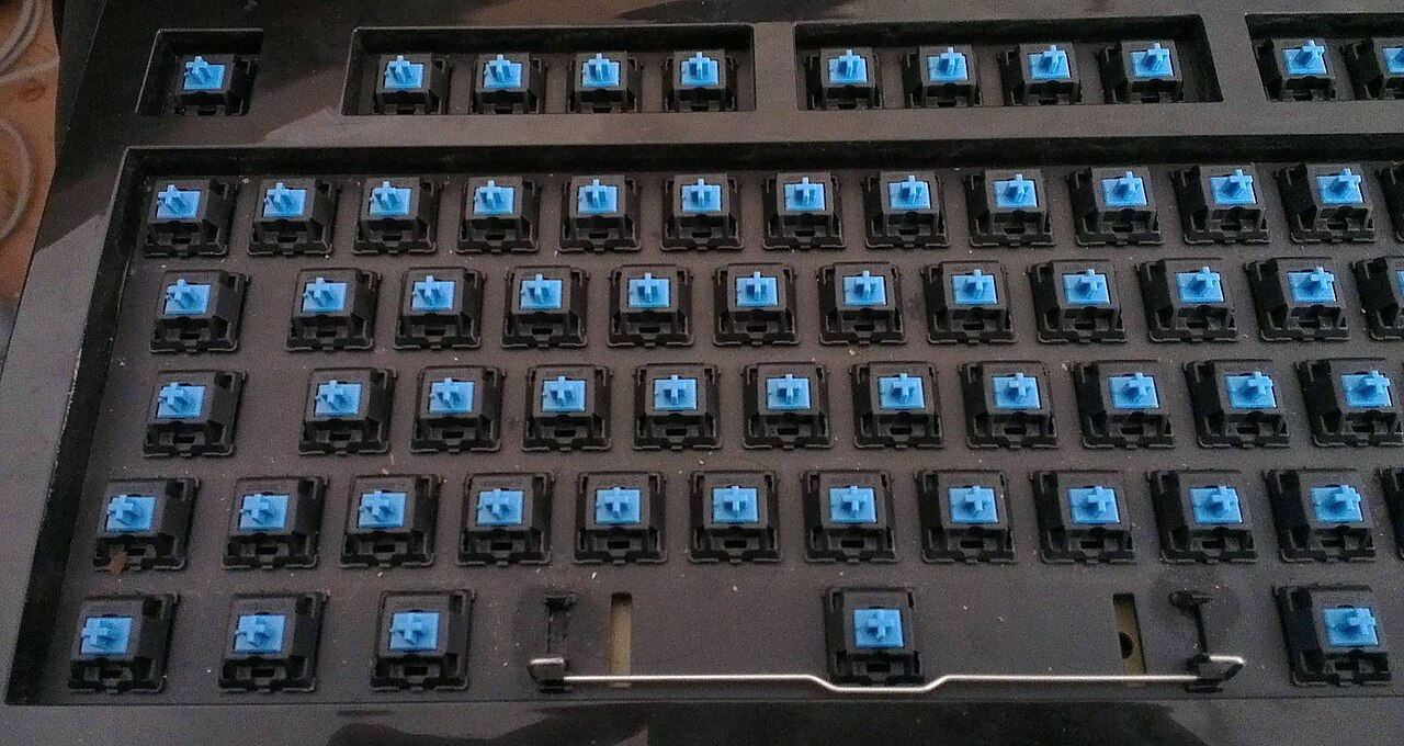 mechanical keyboard switch types guide 2026 — close-up of Cherry MX Blue clicky switches