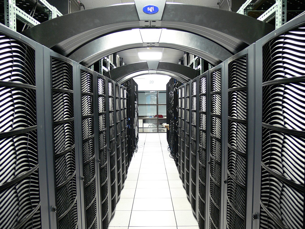 Data center server room with rows of racks, representative of AI infrastructure buildouts