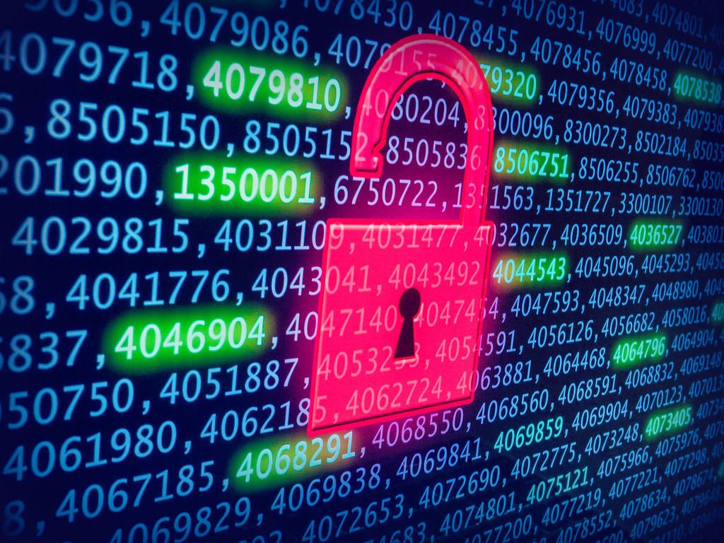Data breach padlock over binary code - Patch Tuesday vulnerabilities