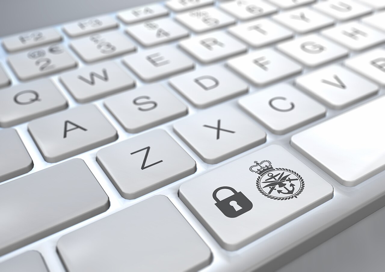 Close-up of a computer keyboard with a padlock security icon, illustrating cybersecurity defense