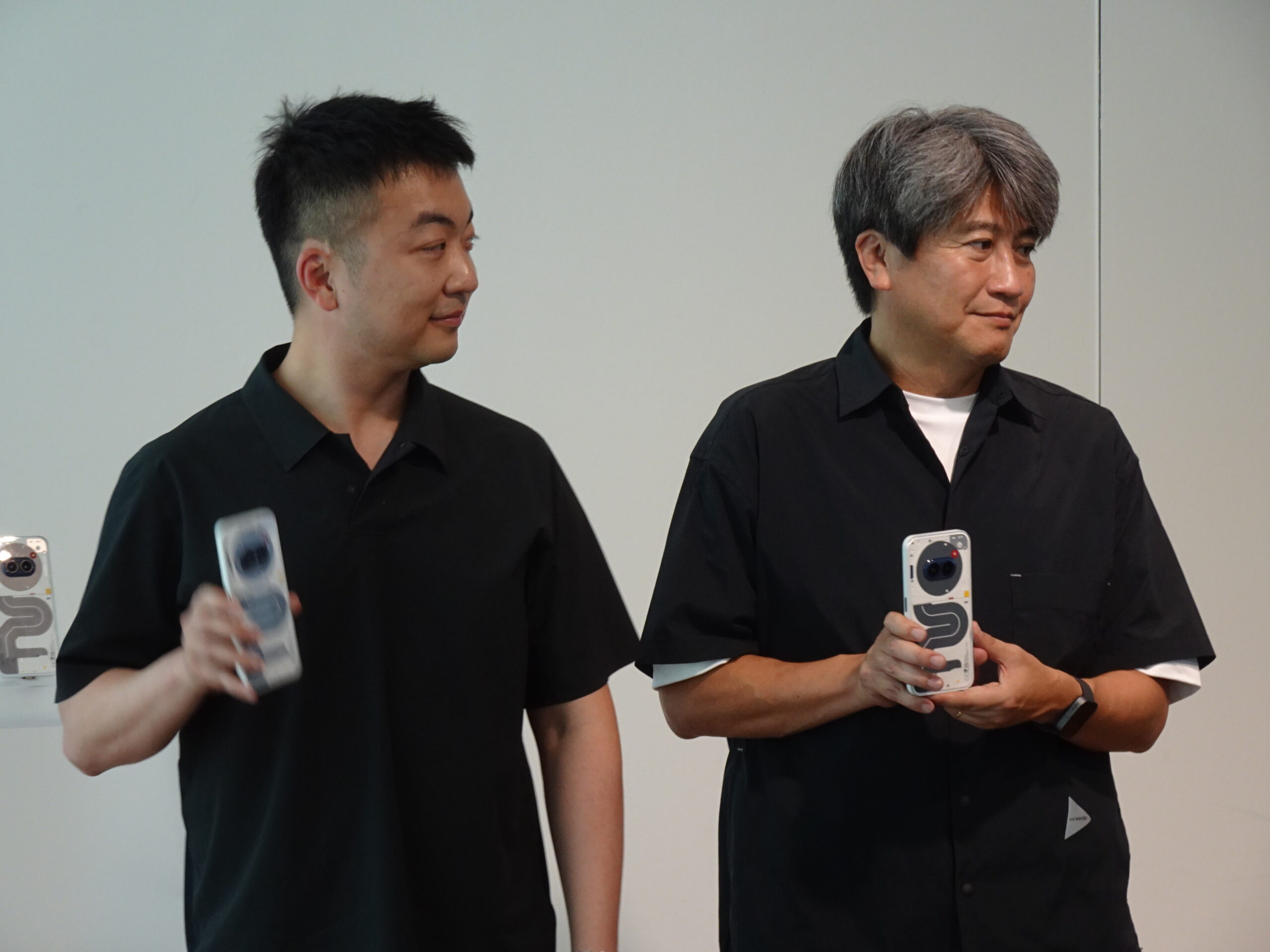 Nothing Technology executives holding Nothing phones at Tokyo design event 2024
