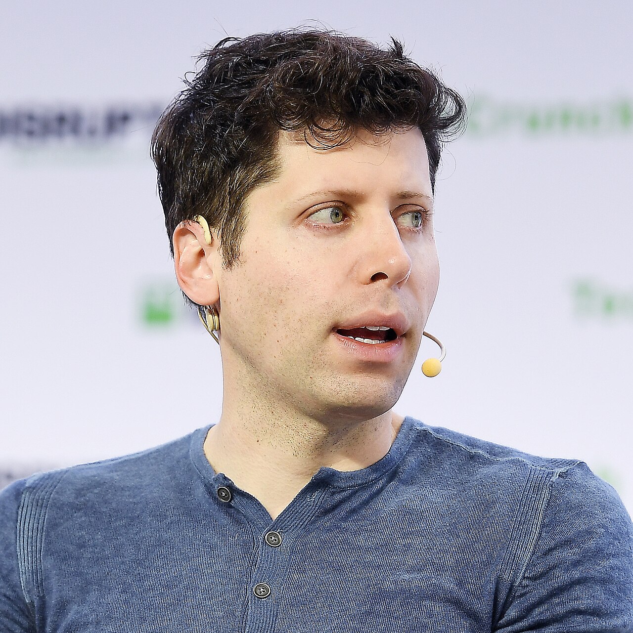 Sam Altman speaking at TechCrunch Disrupt - OpenAI competitive position 2026
