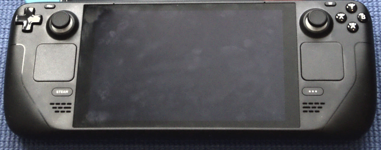 Front view of a Valve Steam Deck handheld gaming PC, showing its screen, joysticks, D-pad, and face buttons