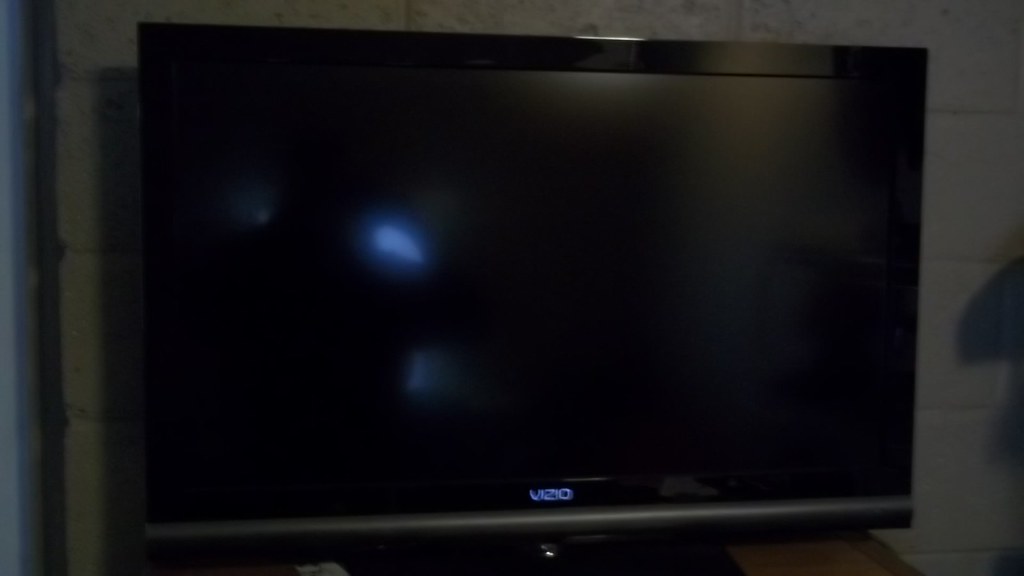 A flat-screen TV mounted on a wall