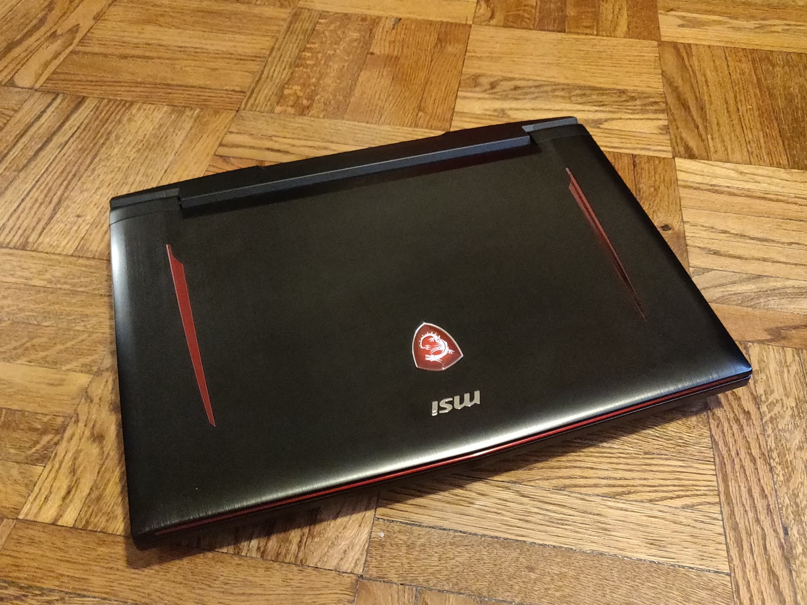 Gaming laptop on a wood floor
