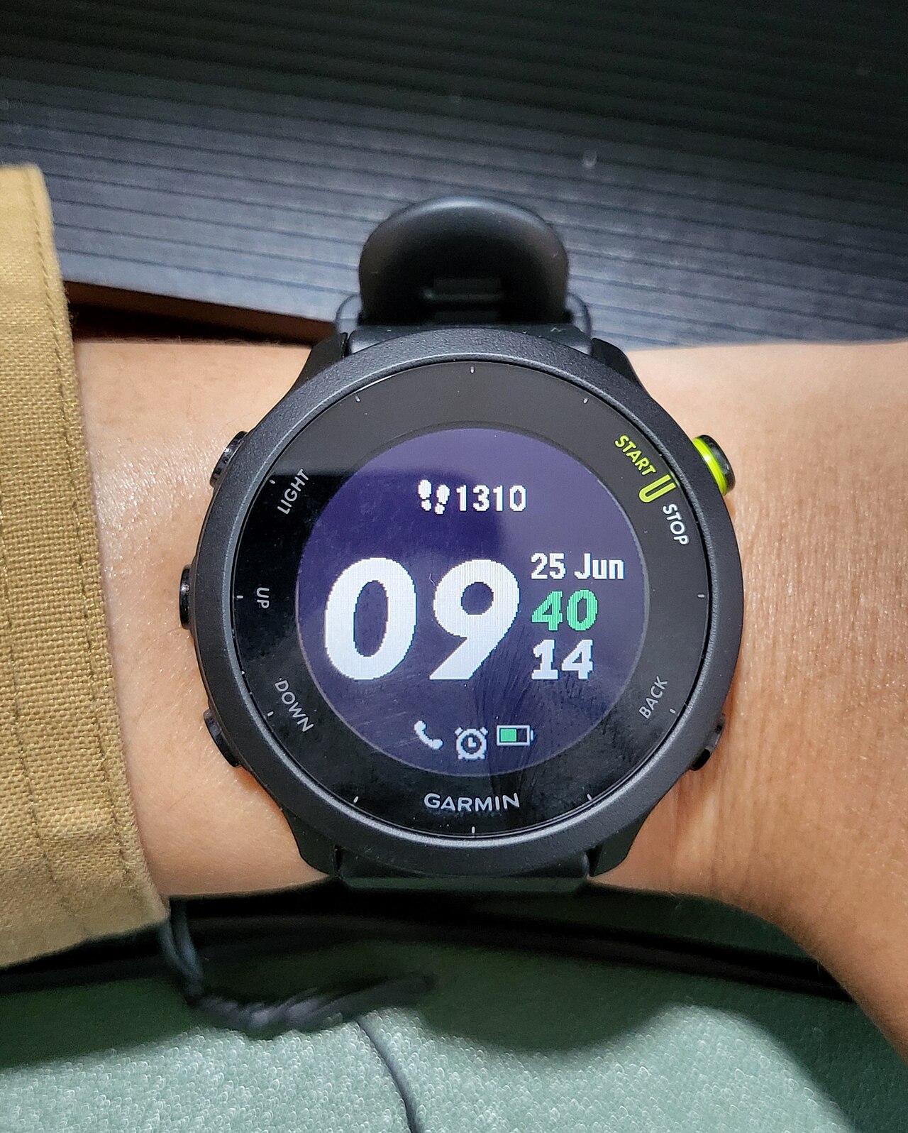 A Garmin fitness smartwatch worn on a wrist