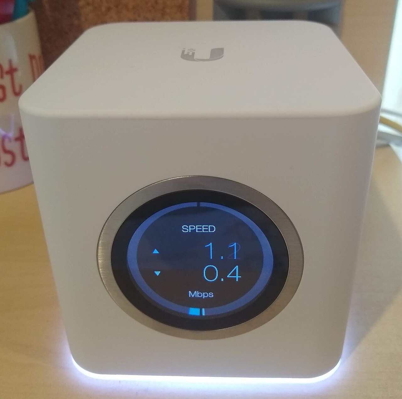 A mesh Wi-Fi router unit with a display