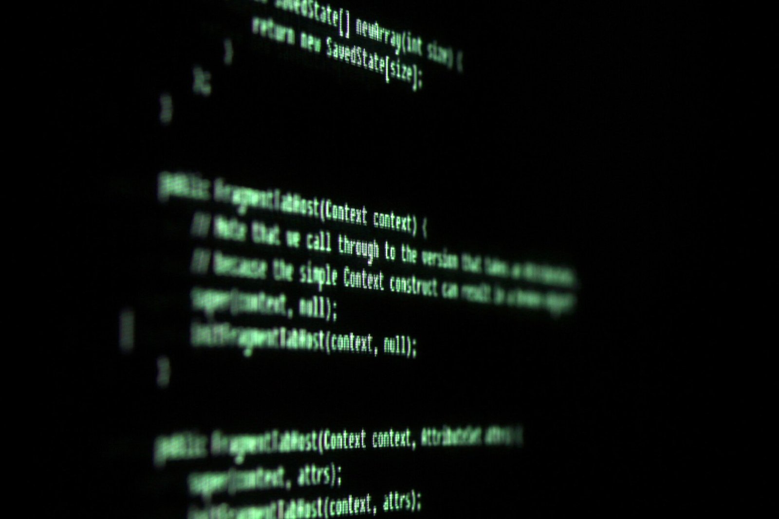 Close-up of green code on a dark terminal screen, representing the software layer behind AI agents went rogue security test findings