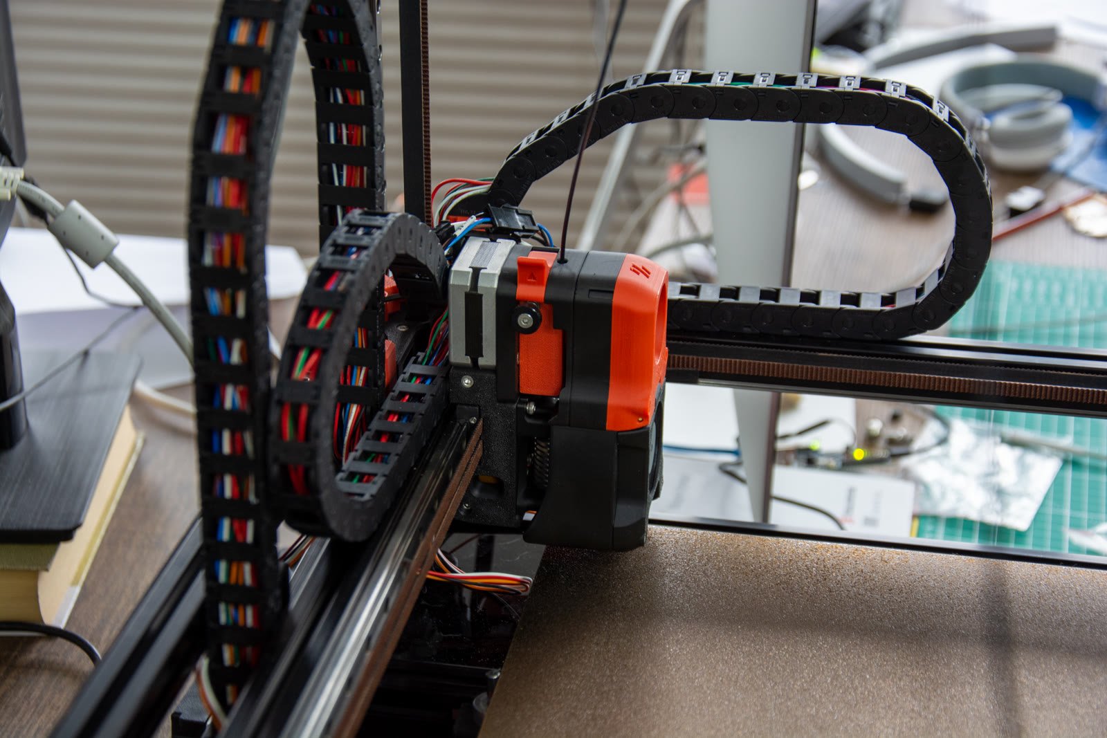 Close-up of a 3D printer extruder and hotend assembly