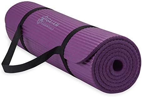 Gaiam thick non-slip yoga and fitness mat rolled up with carrying strap